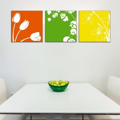 floral canvas wall art in green, orange and yellow