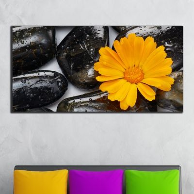 Zen wall decoration with orange flower and spa stones