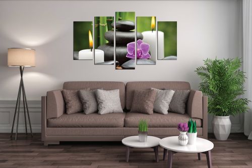 Zen canvas art composition with candles orchid and stones on green background